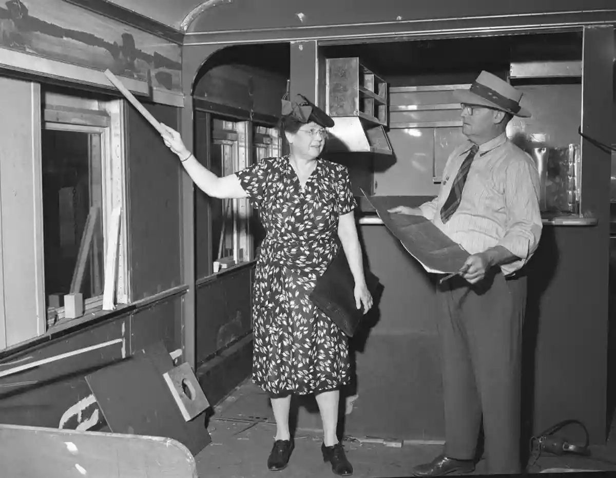 Ruth Dennis points out improvements to a railrad buffet car